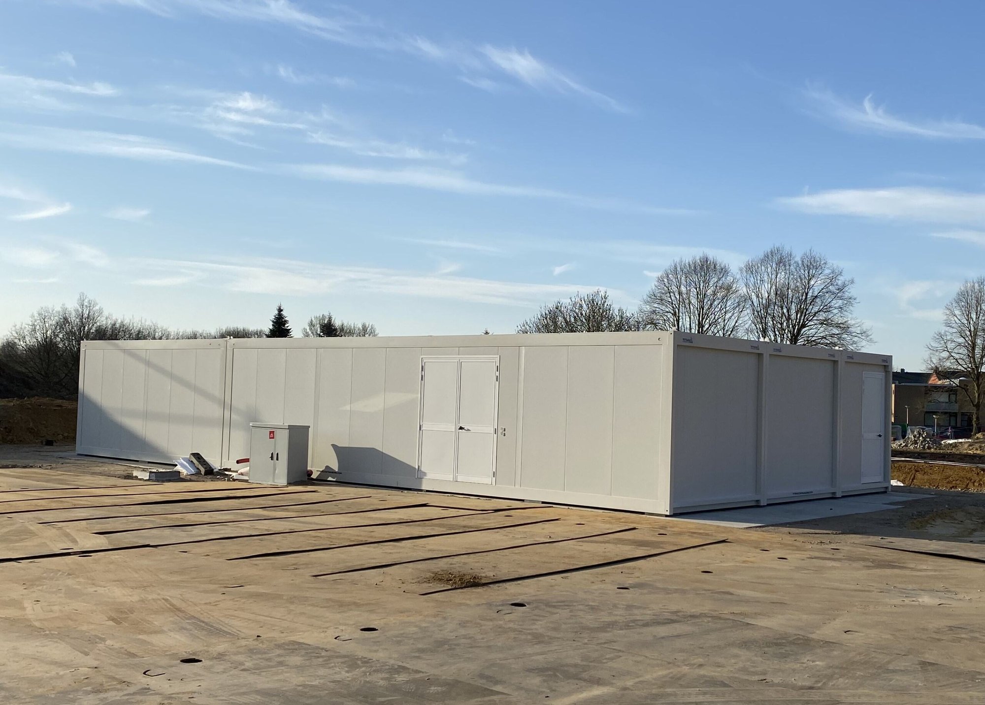 A set of modular office and canteen units by Idelco NV installed on a project site in Wallonia.
