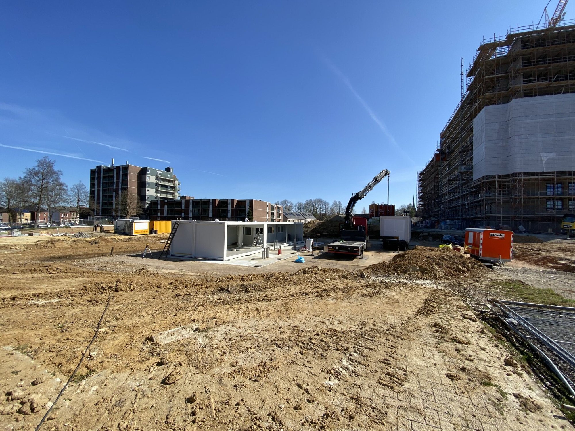 A set of modular office and canteen units by Idelco NV installed on a project site in Wallonia.